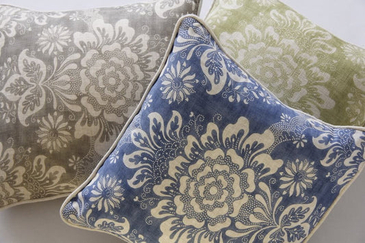 Adele Grey fabric by Arte Fresca Outlet as an elegant decorative cushion, featuring its classic floral ornament pattern in soft grey and delicate ivory with a linen-like texture.