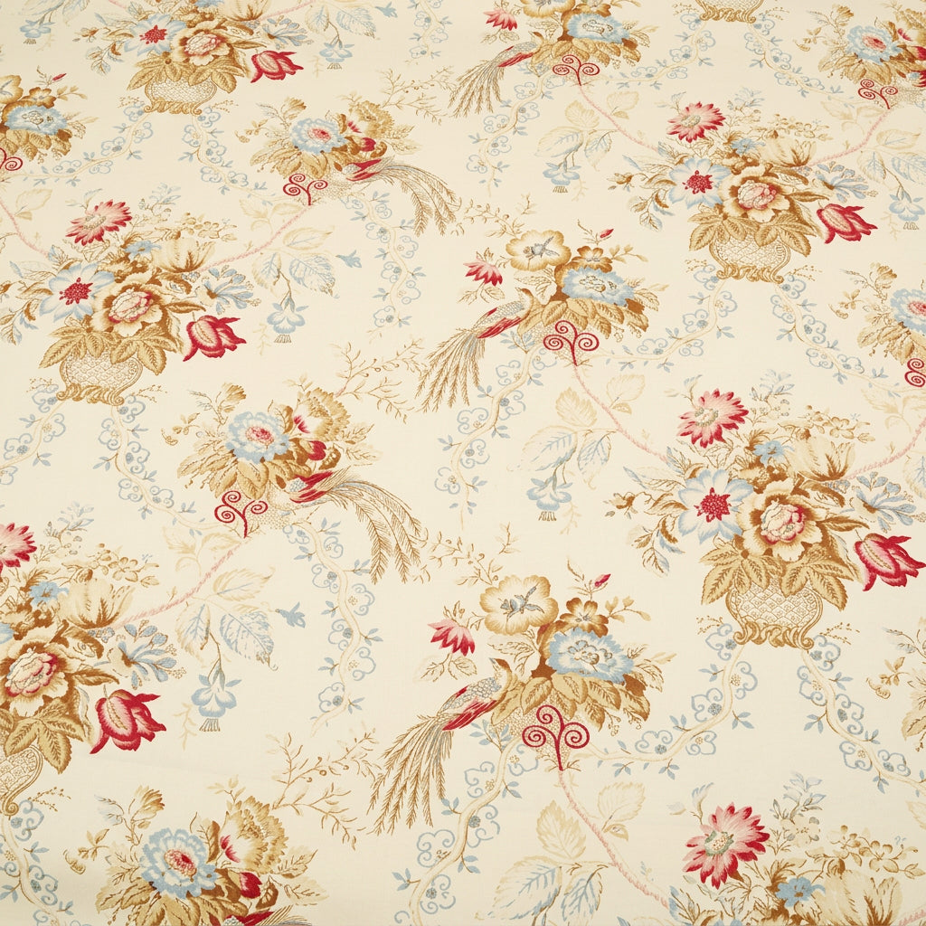 A length of ALLISON CREAM fabric casually draped over a light-colored chair back. The image demonstrates the flexible drape and the scale of the floral pattern in a decorative setting.