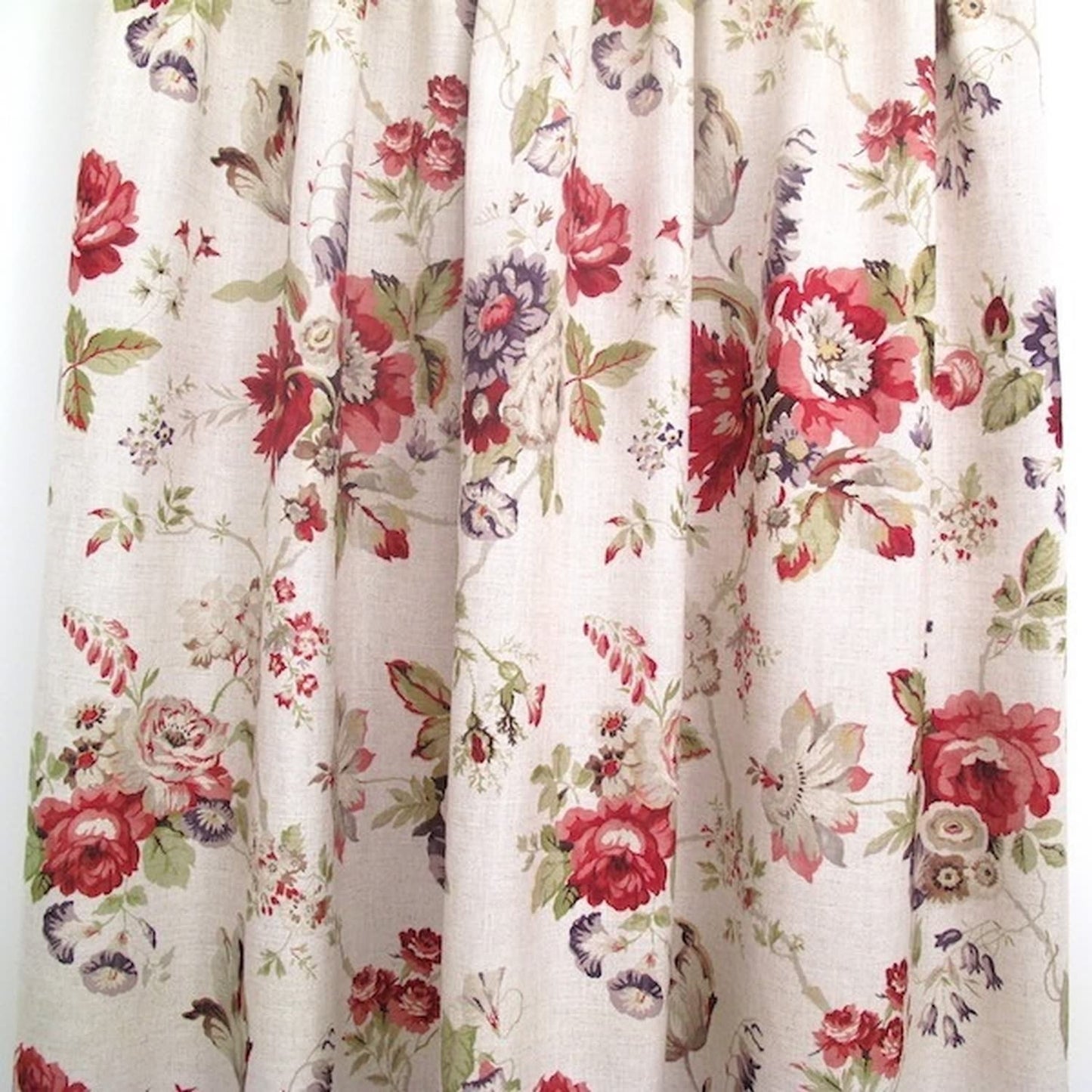 "Victoria Multi/Green fabric from Arte Fresca Outlet, folded like a curtain to demonstrate its natural drape and the full effect of its opulent floral pattern, perfect for elegant window treatments."