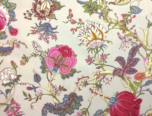 Villars Multi/Ivory fabric coupon by Arte Fresca Outlet, showing a large view of the vibrant botanical pattern on an ivory background. This printed 100% cotton fabric piece features imaginative flowers in magenta, fuchsia, deep red, with blue, turquoise, and green leaves, and subtle accents of cream-yellow and orange, showcasing its smooth texture and elegant drape.