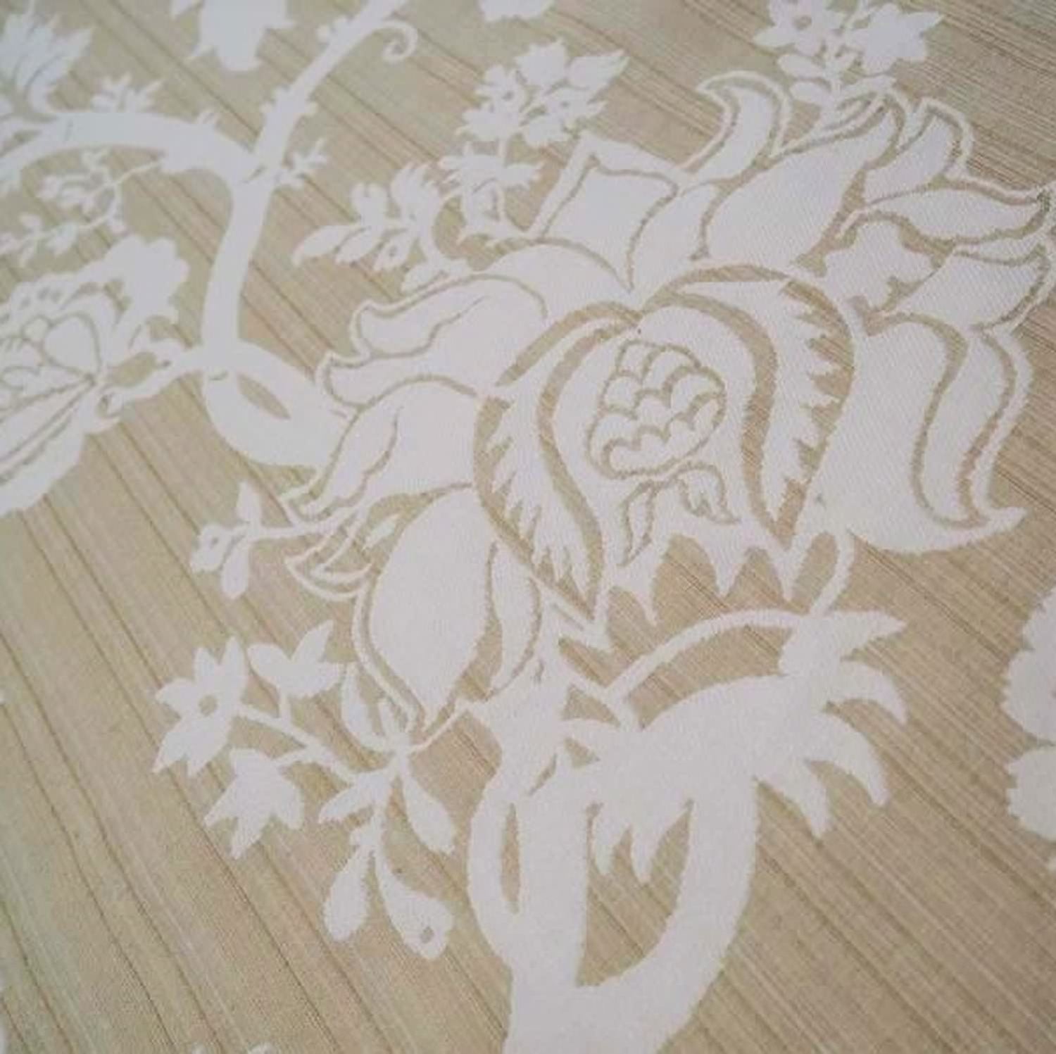  A detailed macro shot of the Arte Fresca Elizabeth Sandstone jacquard fabric, highlighting the woven texture and the intricate details of the floral pattern.