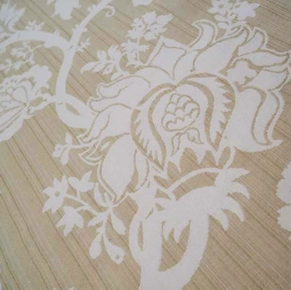  A detailed macro shot of the Arte Fresca Elizabeth Sandstone jacquard fabric, highlighting the woven texture and the intricate details of the floral pattern.