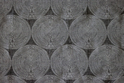  ADAM CHARCOAL fabric by Arte Fresca Outlet, a full view displaying its elegant deep anthracite base and subtle concentric circle pattern in cream and silver-grey, showcasing its woven texture and modern aesthetic.