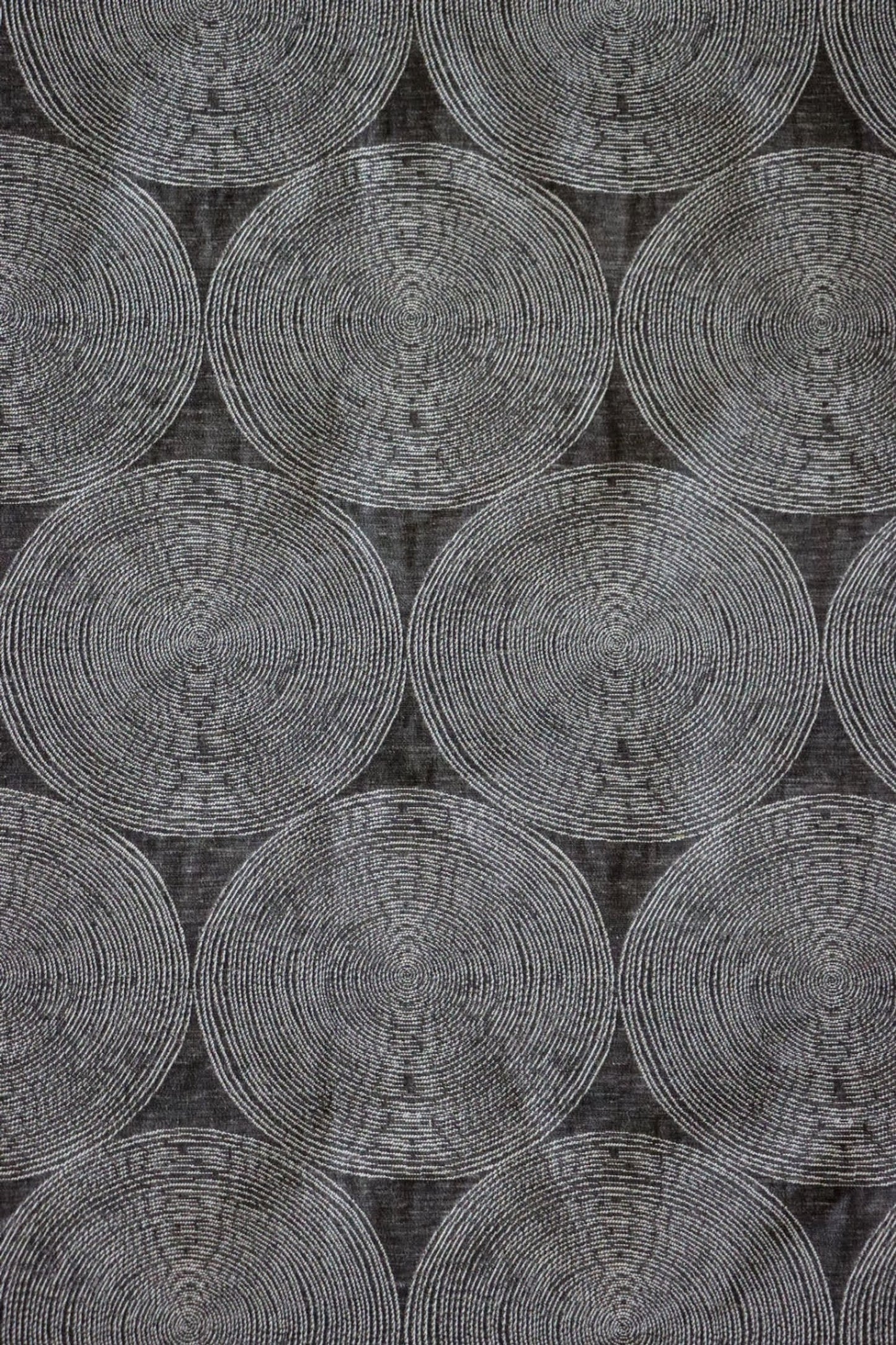 ADAM CHARCOAL fabric by Arte Fresca Outlet, a full view displaying its elegant deep anthracite base and subtle concentric circle pattern in cream and silver-grey, showcasing its woven texture and modern aesthetic.