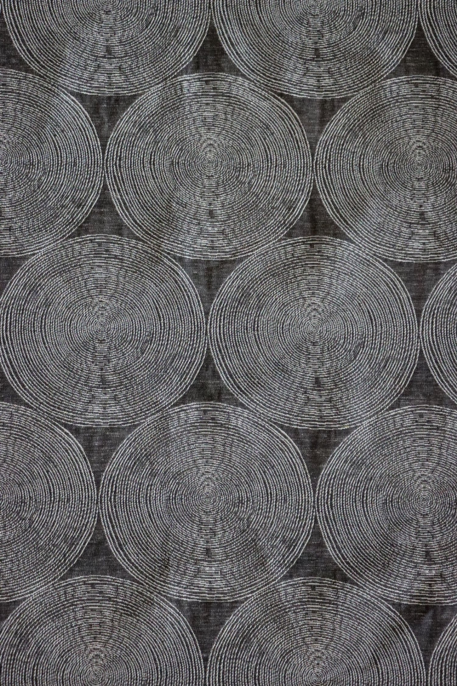 ADAM CHARCOAL fabric by Arte Fresca Outlet, a full view displaying its elegant deep anthracite base and subtle concentric circle pattern in cream and silver-grey, showcasing its woven texture and modern aesthetic.