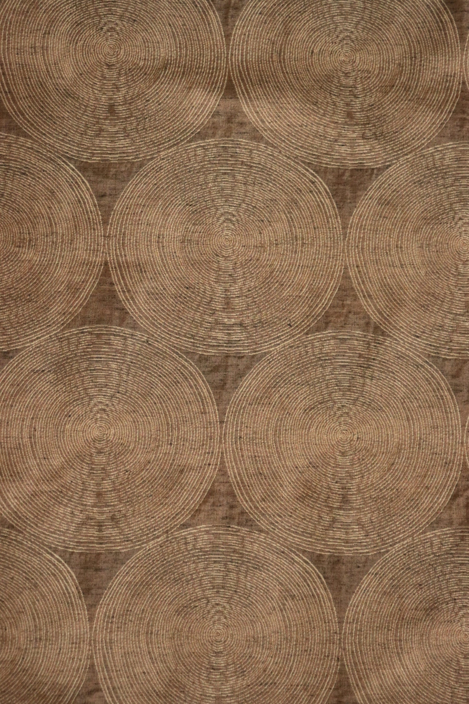 Voisin Gold fabric by Arte Fresca Outlet, showing a large section of the woven fabric with a subtle concentric circle pattern in cream on a rich copper background.