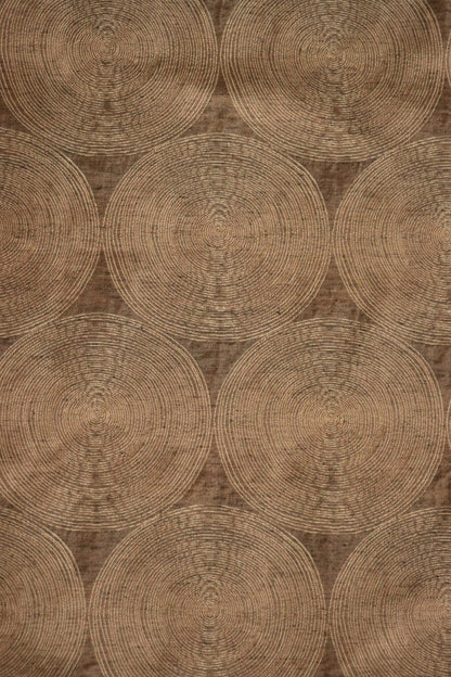 Voisin Gold fabric by Arte Fresca Outlet, showing a large section of the woven fabric with a subtle concentric circle pattern in cream on a rich copper background.