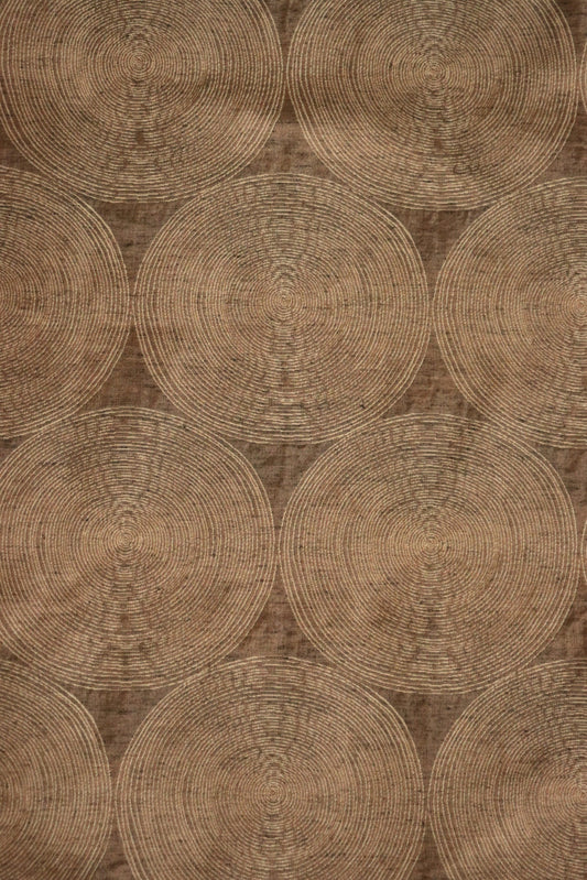 Voisin Gold fabric by Arte Fresca Outlet, showing a large section of the woven fabric with a subtle concentric circle pattern in cream on a rich copper background.