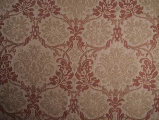 Damask patterned in warm beige and muted terracotta red.