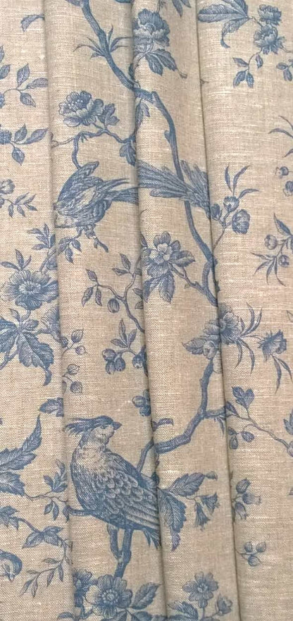 The Conway Lin Blue fabric coupon styled in gentle folds, demonstrating its suitability for curtains and decoration with a charming, timeless feel.