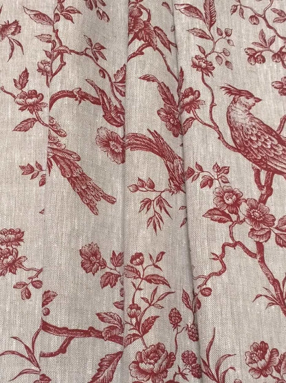 The Conway Lin Red fabric coupon styled in gentle folds, demonstrating its suitability for curtains and decoration with a charming, timeless feel.