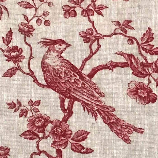 A detailed macro shot of the Arte Fresca Outlet Conway Lin Red fabric, highlighting the rich red pattern and the beautiful, rustic texture of the 100% linen.