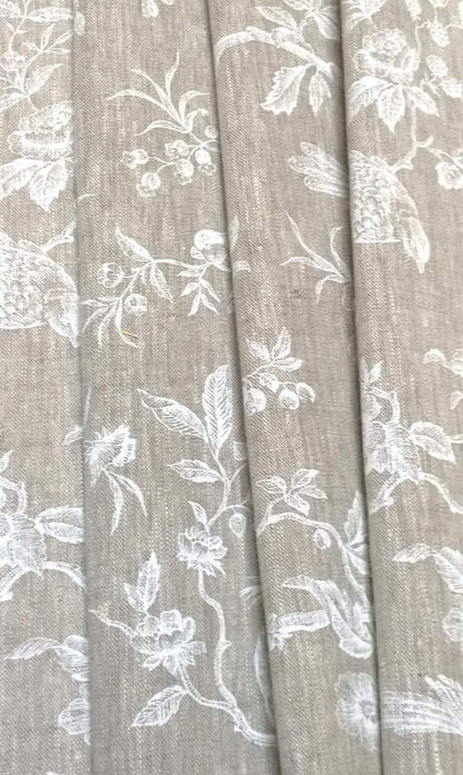 The Conway Lin White fabric coupon styled in gentle folds, demonstrating its suitability for curtains and decoration with a charming, timeless feel.