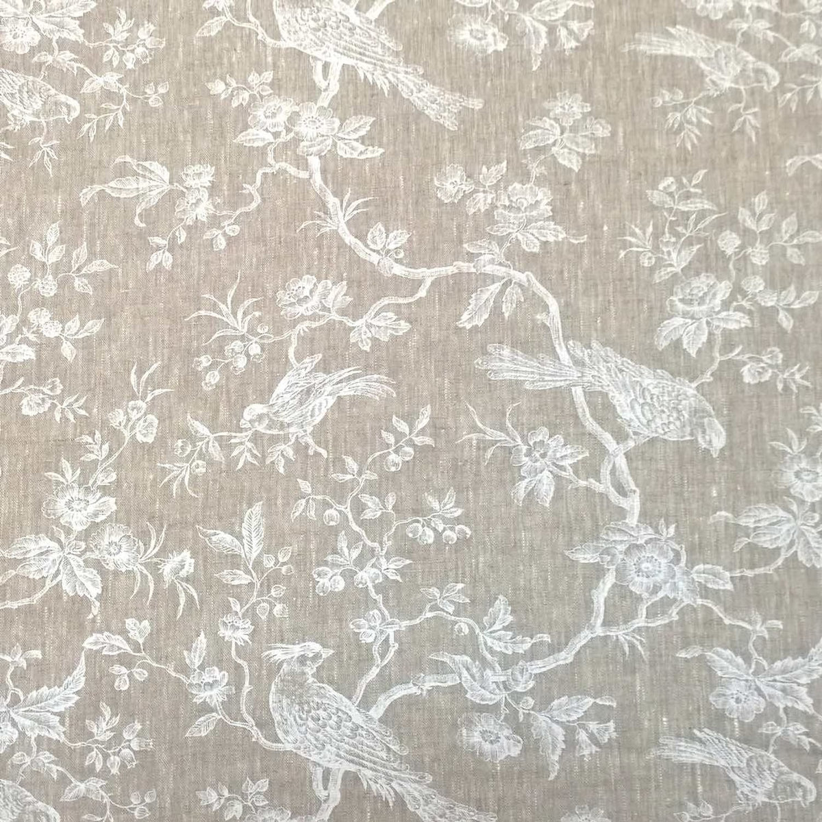 A large view of the Arte Fresca Outlet Conway Lin White fabric coupon, showing the elegant off-white bird and floral pattern on natural linen.