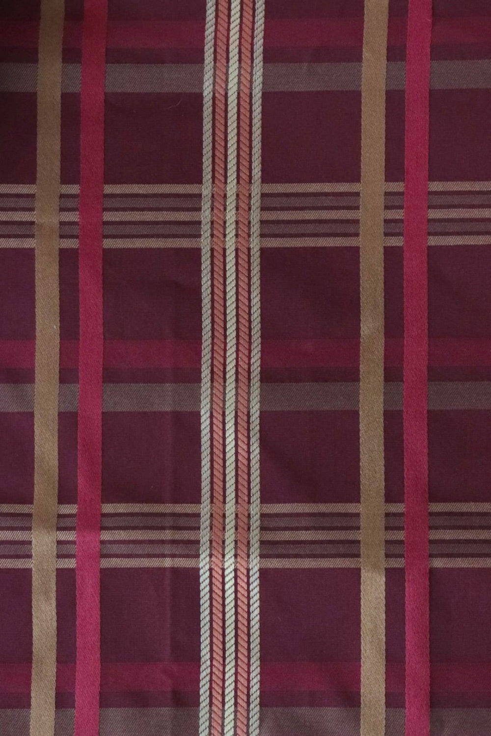 Braxton Check Burgundy fabric by Arte Fresca Outlet, showing a large section of the woven plaid pattern in deep burgundy, gold, beige, and rose tones, highlighting its classic design.