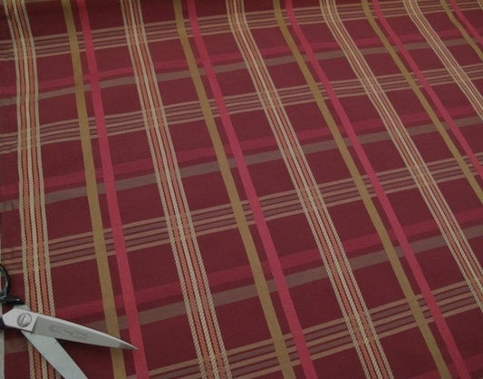 Braxton Check Burgundy fabric by Arte Fresca Outlet, showing a large section of the woven plaid pattern in deep burgundy, gold, beige, and rose tones, highlighting its classic design.