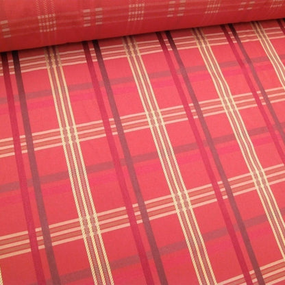 Close-up of BRAXTON CHECK RASPBERRY fabric from ARTE FRESCA Outlet, showcasing its vibrant coral red and burgundy plaid pattern with beige-yellow herringbone accents. This high-quality designer remnant brings British charm to any interior.