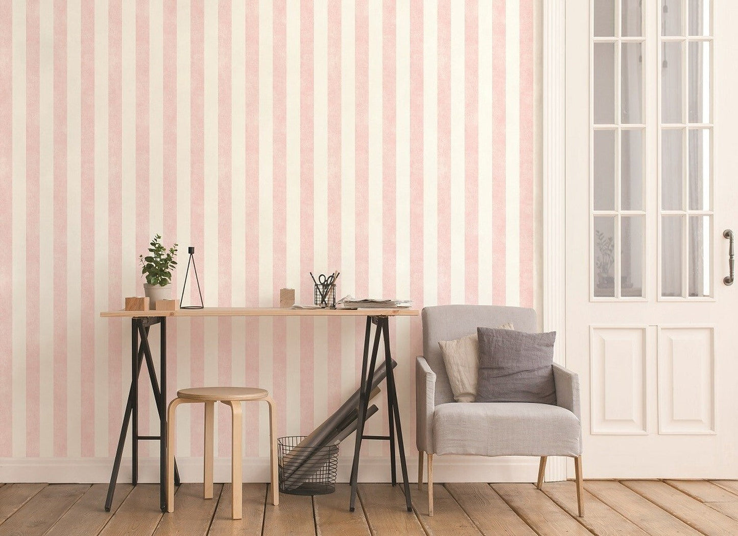 COLOUR WASH STRIPE ROSE wallpaper by Arte Fresca Outlet beautifully installed on a wall, showcasing its elegant vertical stripes in soft rosé and off-white. The subtle texture and harmonious colors create a serene, romantic atmosphere, highlighting its visual impact in a finished room.