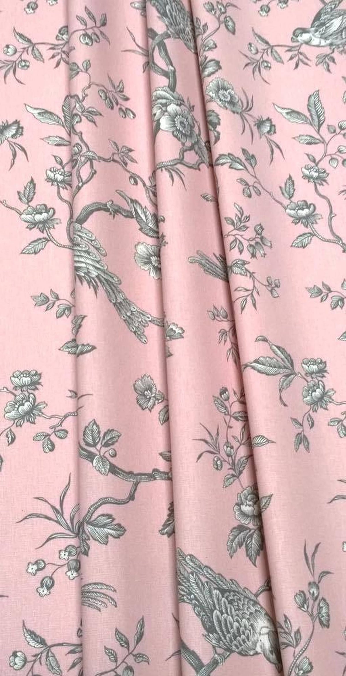 Conway Rose fabric shown in elegant folds, illustrating its use as a curtain material. The romantic bird motif from Arte Fresca Outlet is beautifully displayed in the drapery.