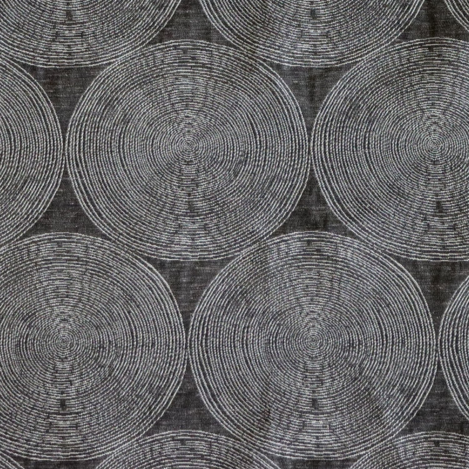 Close-up of ADAM CHARCOAL fabric from Arte Fresca Outlet, revealing the fine weave, the subtle texture within its concentric cream and silver-grey circles on deep anthracite, emphasizing its quality and sophisticated detail.