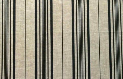 Flat view of printed pure linen fabric featuring a classic multiple stripe pattern in black on a natural beige-grey background