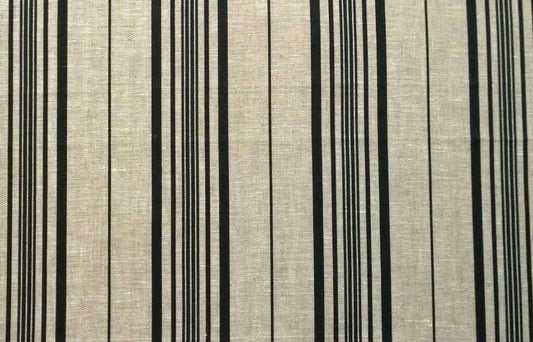 Flat view of printed pure linen fabric featuring a classic multiple stripe pattern in black on a natural beige-grey background