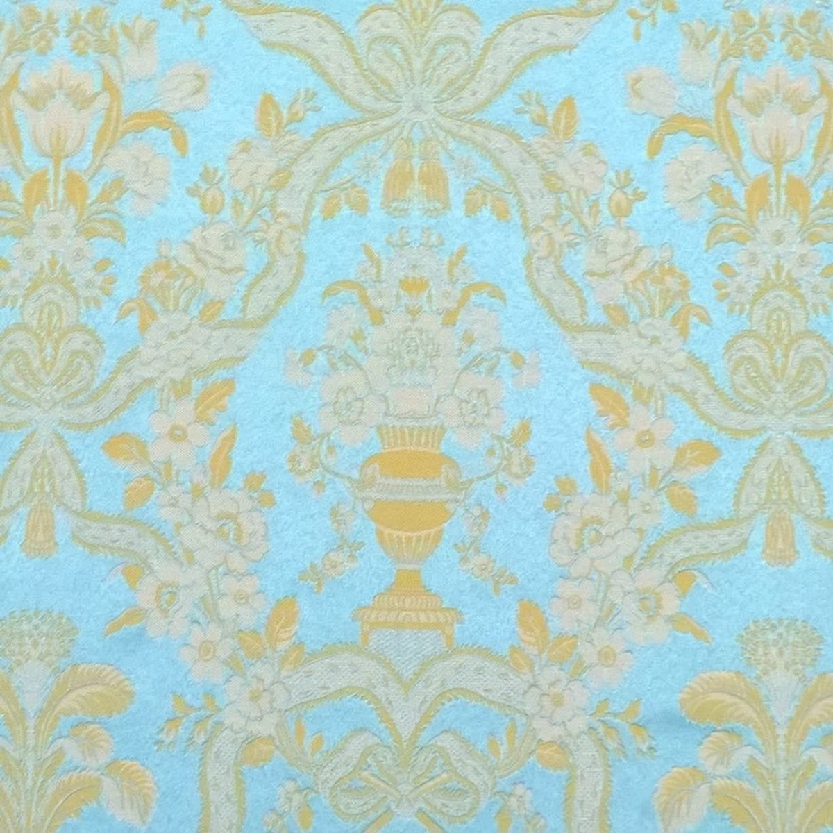 A detailed close-up shot of the Lorraine Turquoise woven fabric, highlighting the rich texture and intricate damask pattern of vases and floral motifs from Arte Fresca Outlet.