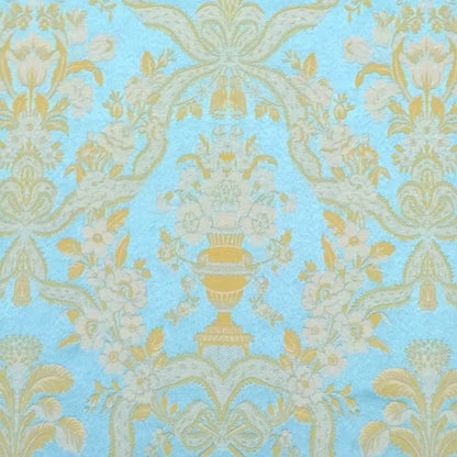 A detailed close-up shot of the Lorraine Turquoise woven fabric, highlighting the rich texture and intricate damask pattern of vases and floral motifs from Arte Fresca Outlet.