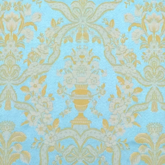 A detailed close-up shot of the Lorraine Turquoise woven fabric, highlighting the rich texture and intricate damask pattern of vases and floral motifs from Arte Fresca Outlet.