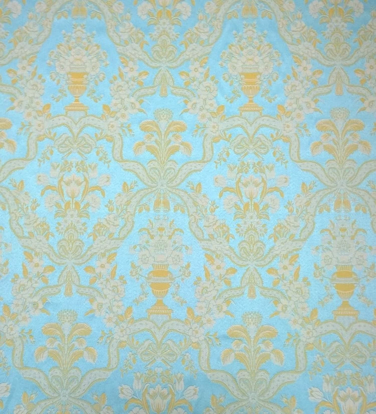 A large view of the Lorraine Turquoise woven fabric from Arte Fresca Outlet, showcasing the full damask pattern with cream-yellow motifs on a vibrant turquoise background.