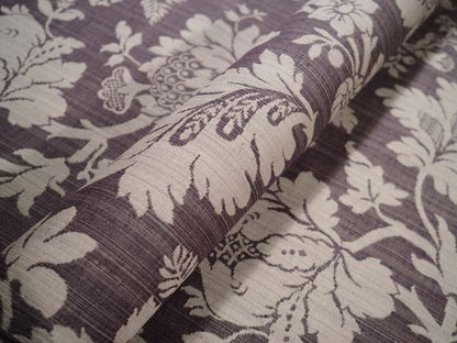 Close-up of MARY AUBERGINE jacquard fabric from Arte Fresca Outlet, revealing the intricate details of its large floral pattern, the rich aubergine and beige tones, and the tactile, raised texture characteristic of jacquard weaving.