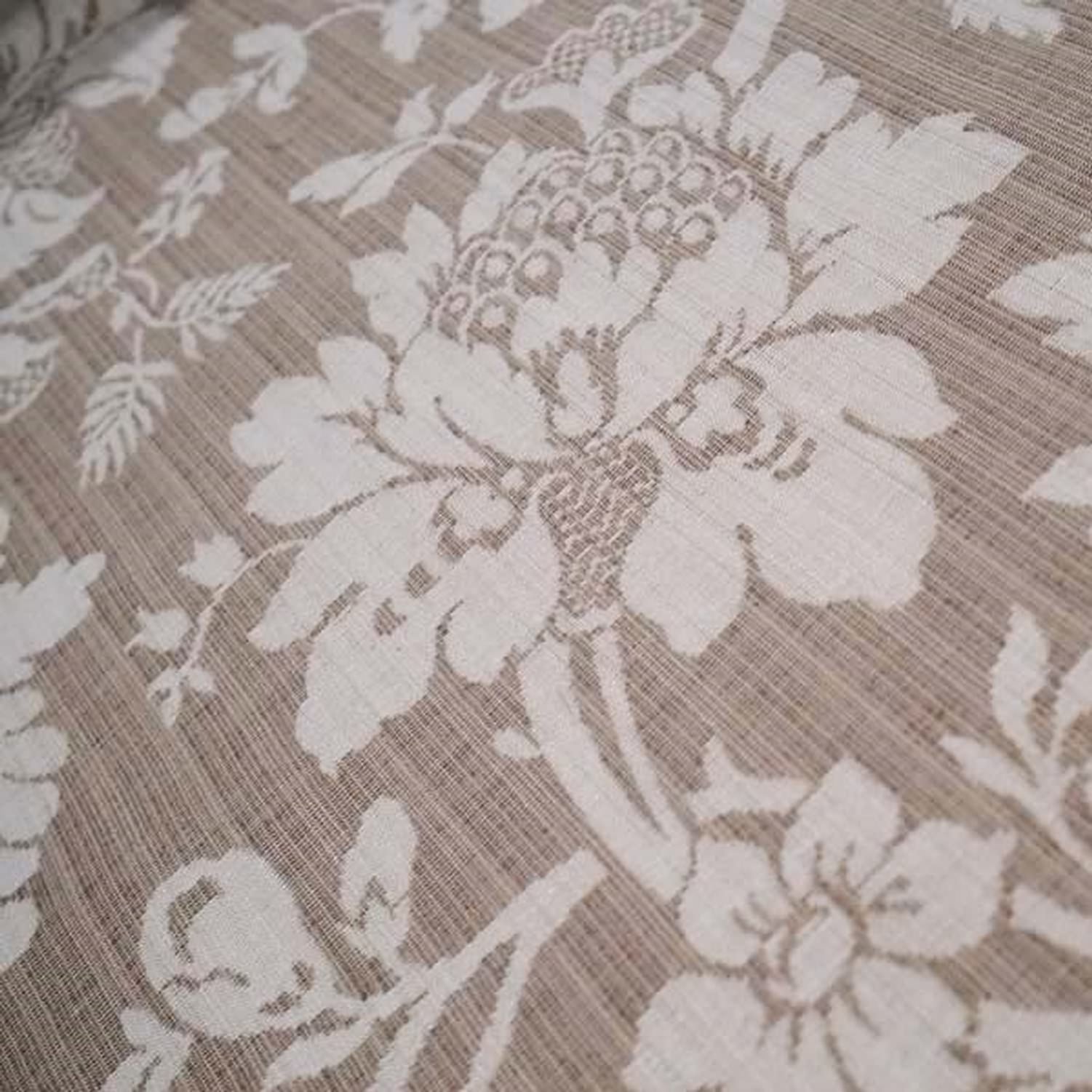 Close-up of MARY BEIGE jacquard fabric from Arte Fresca Outlet, revealing the intricate details of its large floral pattern, the subtle tonal beige colors, and the tactile, raised texture characteristic of jacquard weaving.