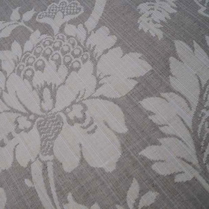 Detailed close-up of MARY GREY fabric by Arte Fresca Outlet, highlighting the intricate woven floral motifs and subtle texture of this elegant grey and beige jacquard.
