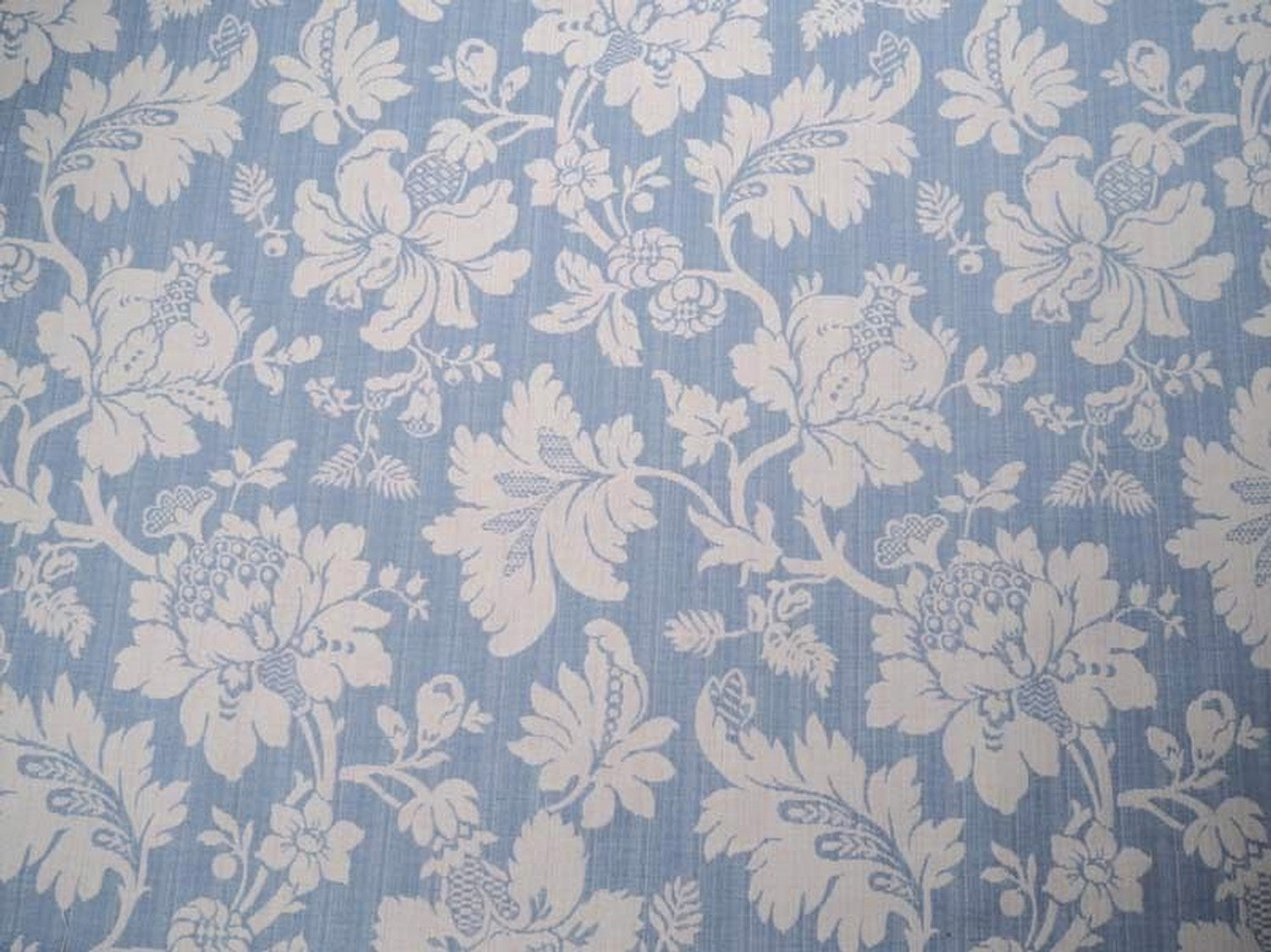 Mary Light Blue jacquard fabric by Arte Fresca Outlet, featuring a large view of the delicate white floral pattern on a powder blue background, ideal for elegant home decor.