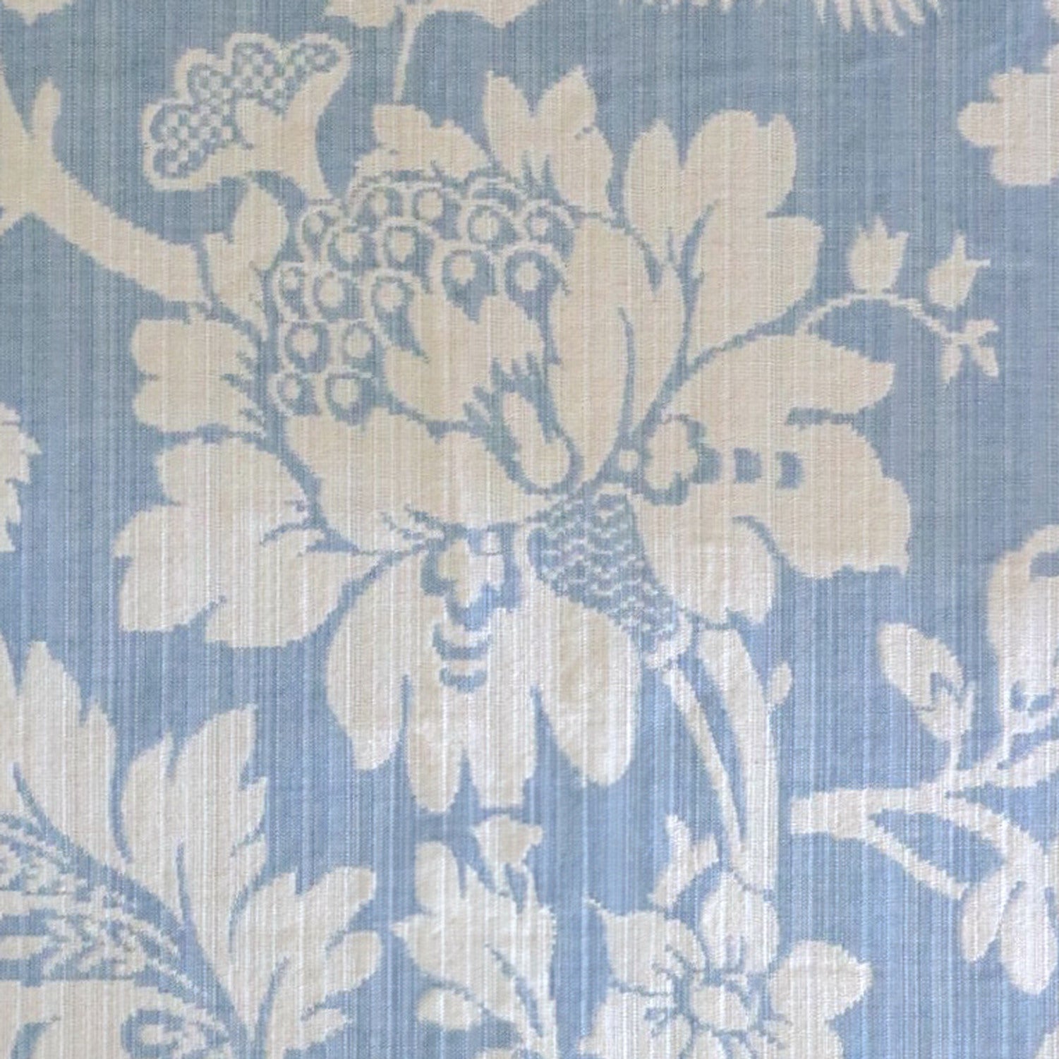 Mary Light Blue jacquard fabric by Arte Fresca Outlet, featuring a large view of the delicate white floral pattern on a powder blue background, ideal for elegant home decor.