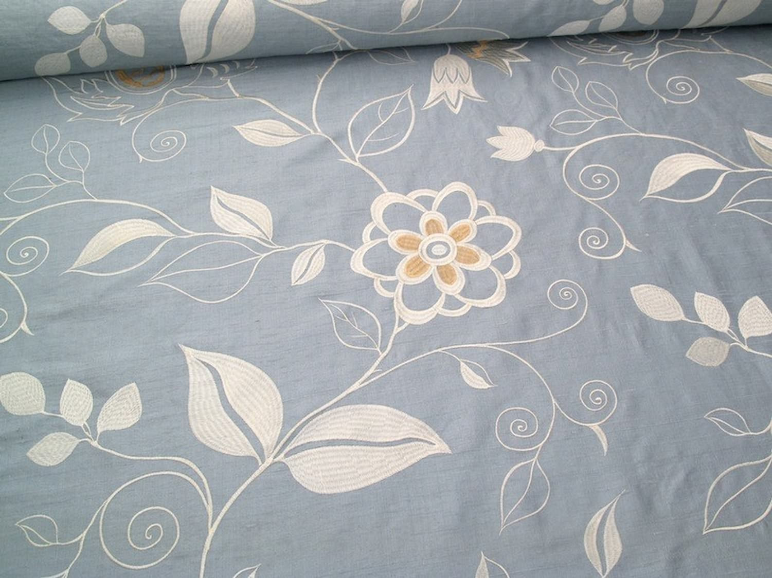 MOREEN AQUA embroidered silk fabric by Arte Fresca Outlet, a luxurious blend of 80% silk and 20% rayon. It features a large-scale, tactile floral embroidery in silvery ivory and creamy beige on a soft, subtly shimmering aqua light-blue ground, perfect for elegant romantic interiors.