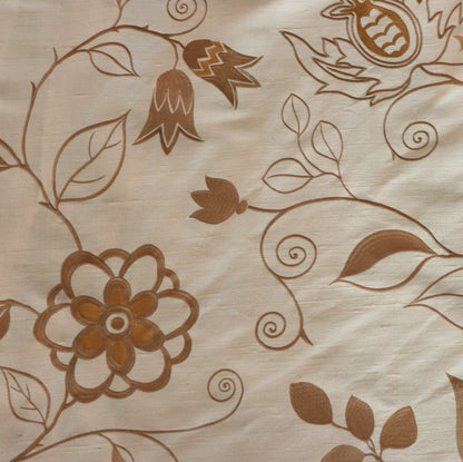 Close-up of MOREEN CAMEL silk fabric from Arte Fresca Outlet, revealing the intricate details of its fine embroidered floral motifs in brown, the soft camel base, and the tactile, raised quality of the exquisite silk and embroidery.