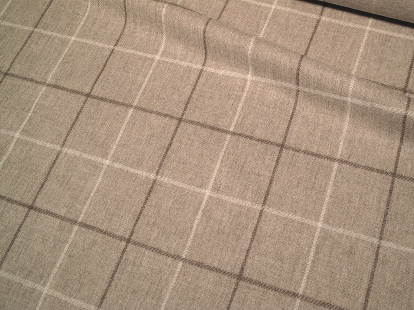OXFORD CHECK NATURAL fabric by Arte Fresca Outlet, a full view displaying its classic woven check pattern in warm mottled light beige with brown-beige and cream-white accents, highlighting its 100% wool texture.

