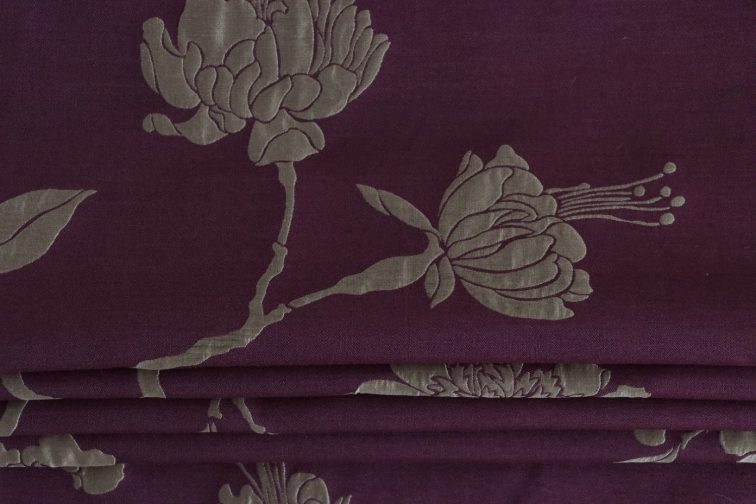 PENCARROW DARK RED silk fabric by Arte Fresca Outlet folded to resemble a roller blind, emphasizing its structured yet elegant appearance, deep dark red color, and gold-silver floral pattern suitable for sophisticated window treatments.