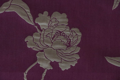 Close-up of PENCARROW DARK RED silk fabric from Arte Fresca Outlet, highlighting the intricate floral pattern, elegant relief-like structure, and soft silken sheen on its dark red base with gold undertones.