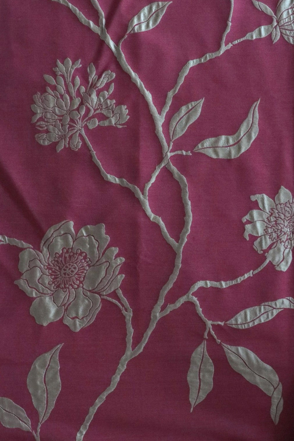 PENCARROW RASPBERRY GOLD silk fabric by Arte Fresca Outlet, a full view displaying its luxurious floral pattern in shimmering gold on a rich raspberry red, highlighting its elegant woven texture.