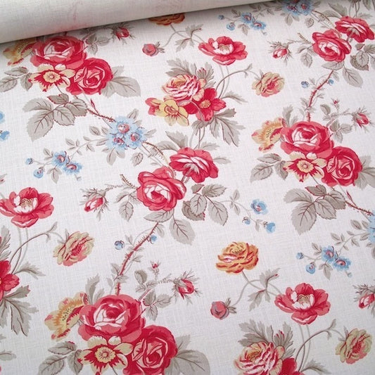 Close-up of Philippa Red fabric by Arte Fresca Outlet, detailing the opulent red roses, delicate blue and yellow wildflowers, and subtle cream texture of the printed linen blend.