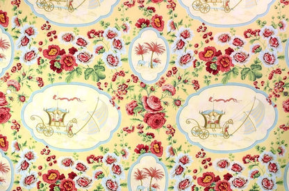 A large view of the SULTANS VOYAGE MULTI/YELLOW fabric from Arte Fresca Outlet, featuring a vibrant, exotic floral pattern with historical medallions on a warm yellow background.