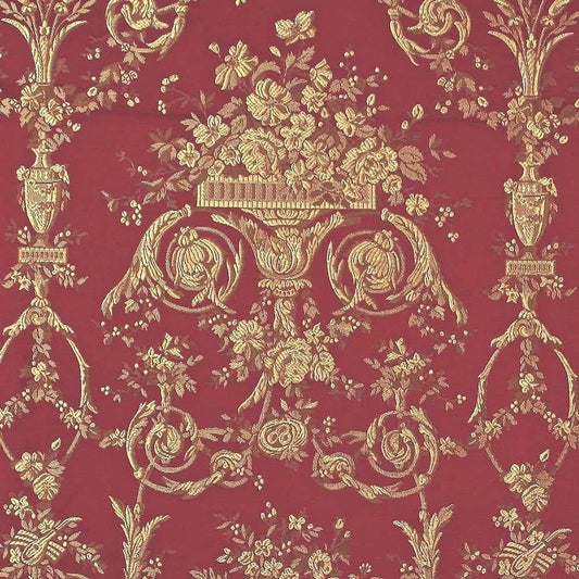  A close-up of the reduced-price VILLA BORGHESE fabric coupon from Arte Fresca Outlet. The image shows the full, opulent pattern of rococo flowers and ornaments in shimmering gold on a rich red background, highlighting the quality of the woven fabric.