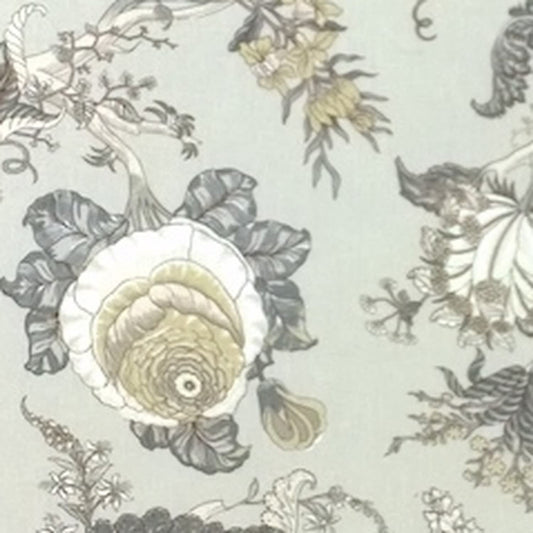 Close-up of Villars Beige/Gray fabric coupon from Arte Fresca Outlet, revealing the intricate details of its botanical print. Muted gray and beige flowers and plants with delicate yellow/olive accents are visible on the light beige-gray background, highlighting the fine lines and smooth texture of this printed 100% cotton fabric piece.
