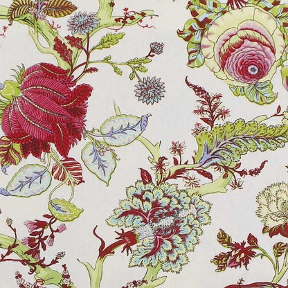 Close-up of Villars Green/White fabric coupon from Arte Fresca Outlet, revealing the intricate details of the botanical print. Muted red, green, yellow, and white flowers and plants are clearly visible on the creamy white background, showcasing the fine lines and smooth texture of this 100% cotton fabric piece.