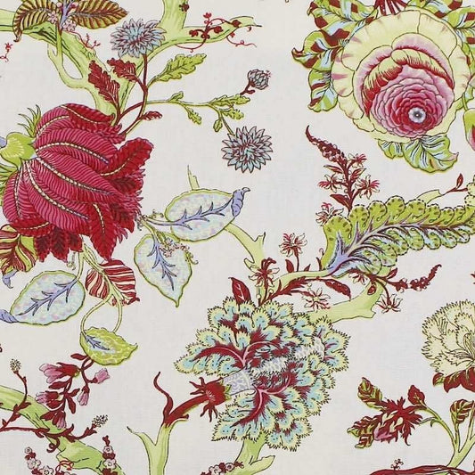 Close-up of Villars Green/White fabric coupon from Arte Fresca Outlet, revealing the intricate details of the botanical print. Muted red, green, yellow, and white flowers and plants are clearly visible on the creamy white background, showcasing the fine lines and smooth texture of this 100% cotton fabric piece.