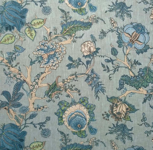Villars Lin Duck Egg fabric coupon by Arte Fresca Outlet, showing a large view of the detailed botanical pattern on a soft duck egg blue background with a linen-like texture. This printed 100% cotton fabric piece features imaginative flowers in various blue tones, with fresh green and creamy beige accents for branches and blossoms, highlighting its smooth feel and elegant design.