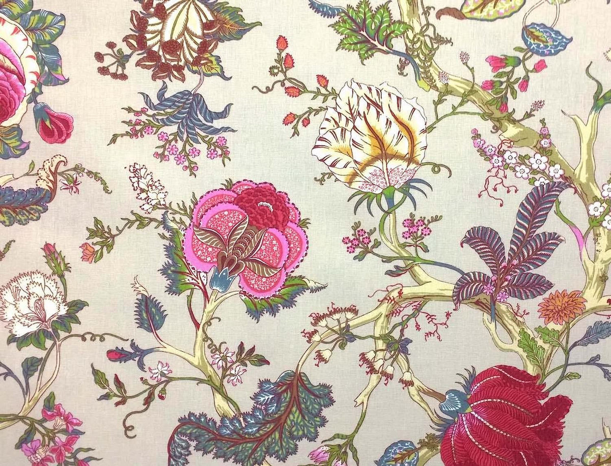 Villars Multi/Ivory fabric coupon by Arte Fresca Outlet, showing a large view of the vibrant botanical pattern on an ivory background. This printed 100% cotton fabric piece features imaginative flowers in magenta, fuchsia, deep red, with blue, turquoise, and green leaves, and subtle accents of cream-yellow and orange, showcasing its smooth texture and elegant drape.