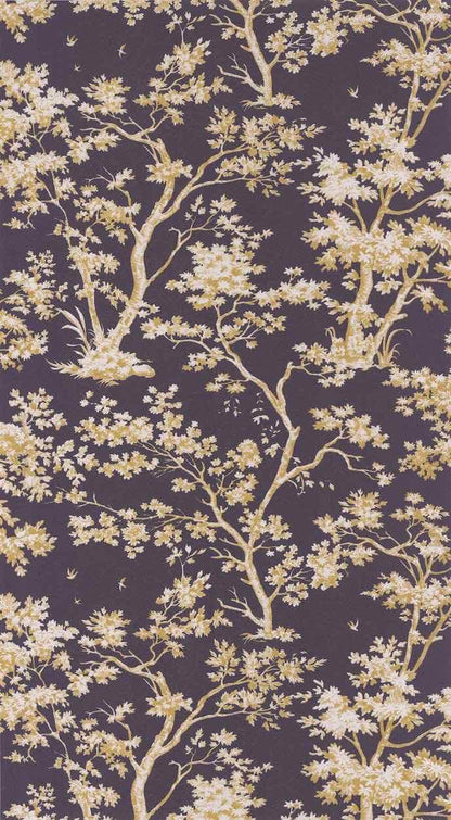 A close-up of a repeating floral toile pattern with pale yellow blossoms and branches on a dark plum-purple background.